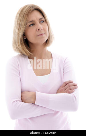 Pensive woman standing with folded arms Banque D'Images