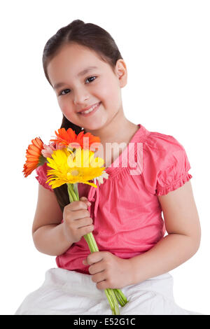 Portrait of little girl holding Flowers Banque D'Images