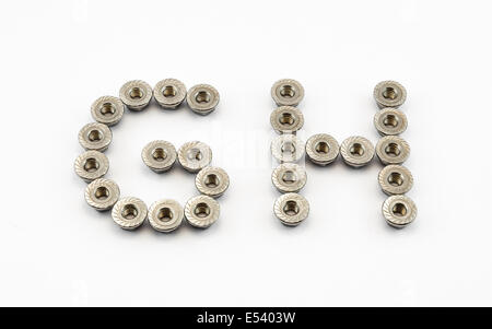 G et H de l'Alphabet, créé par les écrous à embase hexagonale en acier inoxydable. Banque D'Images
