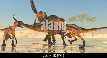 Un pack de Deinonychus les dinosaures attaquent un Tenontosaurus durant la période du Crétacé d'Amérique du Nord. Banque D'Images