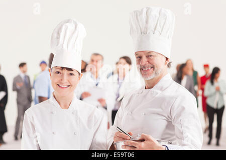 Portrait of smiling chefs Banque D'Images