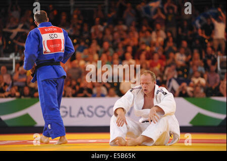 Glasgow, Ecosse, Royaume-Uni. 26 juillet, 2014. Les scènes dramatiques comme Euan Burton combat Jason Koster pour aller jusqu'à la Men's -100kg Finale. Crédit : Michael Preston/Alamy Live News Banque D'Images