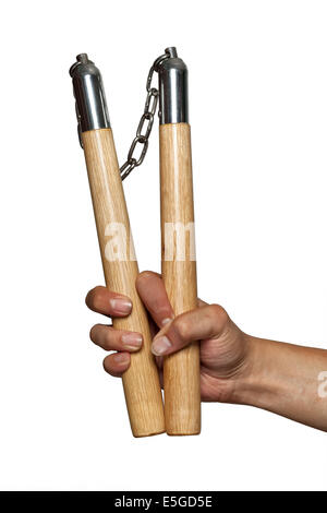 Nunchucks dans man main sur fond blanc Banque D'Images