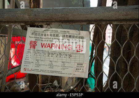 Avertissement signe d'appâtage de toxiques dans les environs. Hong Kong, Chine. Banque D'Images