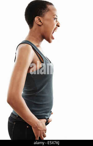 Studio shot of young woman shouting Banque D'Images