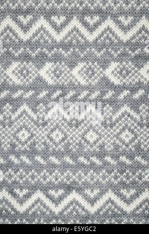Arrière-plan de tricots tricotés avec motif géométrique gris et blanc Banque D'Images