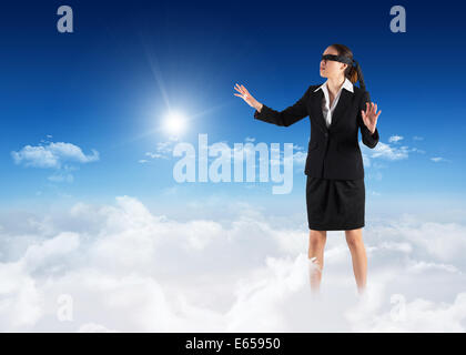 Image composite de bandés businesswoman with hands out Banque D'Images