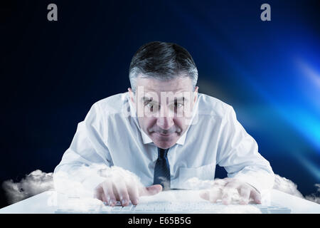 Composite image of businessman de taper au clavier Banque D'Images