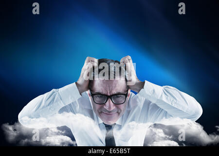 Composite image of businessman touching sa tête Banque D'Images