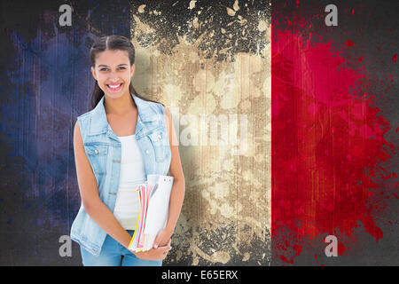 Image composite de student holding des blocs-notes Banque D'Images