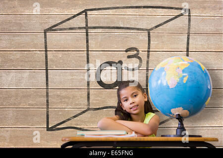 Image composite de cute pupils sitting at desk Banque D'Images