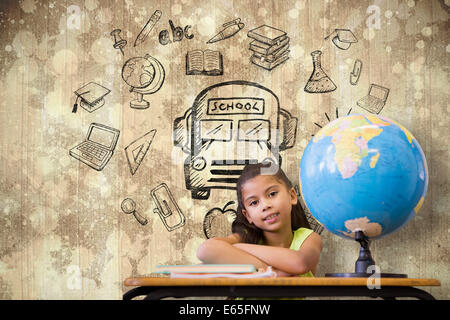 Image composite de cute pupils sitting at desk Banque D'Images