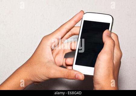 Téléphone mobile dans la main Banque D'Images