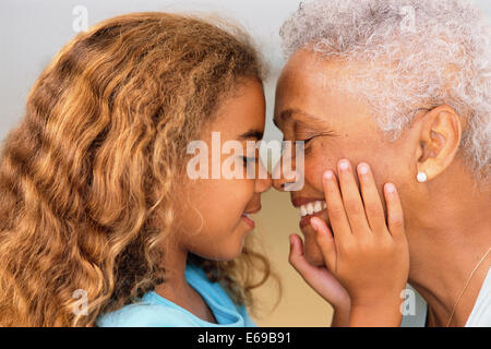 Senior woman and granddaughter touching noses Banque D'Images