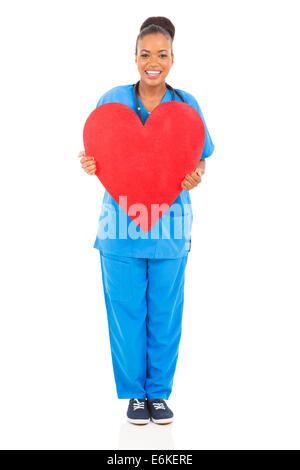 Happy African nurse holding heart shape Banque D'Images