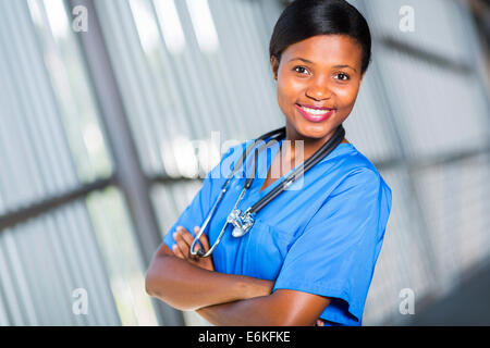 Pretty young African American doctor with arms crossed Banque D'Images