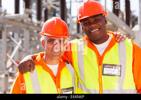 Portrait of happy power company electrical co-workers Banque D'Images