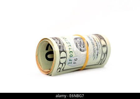 Rouleau de 20 dollar bills sur fond blanc. Isolated on white Banque D'Images