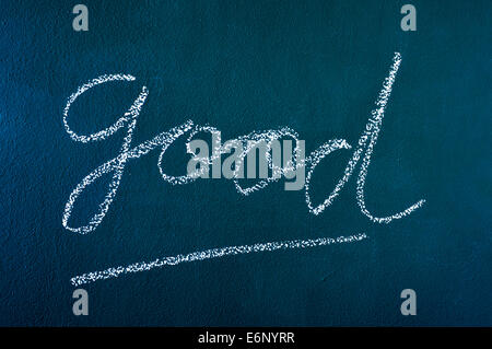 Le mot bon écrit avec la craie sur un tableau noir Banque D'Images