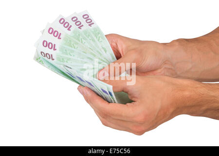 Male hand holding cent euro argent billets, isolé sur fond blanc. Banque D'Images