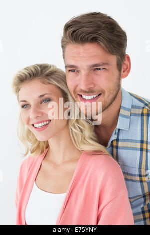 Attractive young couple looking away Banque D'Images
