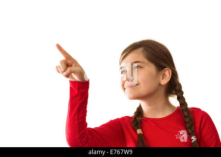 Cute little girl smiling and pointing Banque D'Images