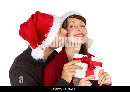 Couple holding a Christmas Gift Banque D'Images