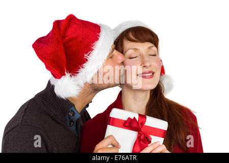 Couple holding a Christmas Gift Banque D'Images