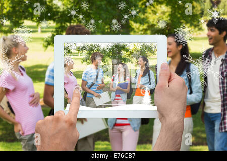 Image composite de hand holding tablet pc Banque D'Images