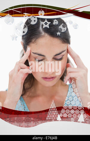 Image composite de portrait of a young woman having a headache Banque D'Images