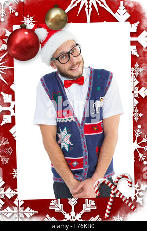 Image composite de hipster geek in santa hat Banque D'Images