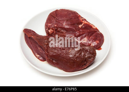 Steaks de viande de kangourou crus isolated on a white background studio. Banque D'Images