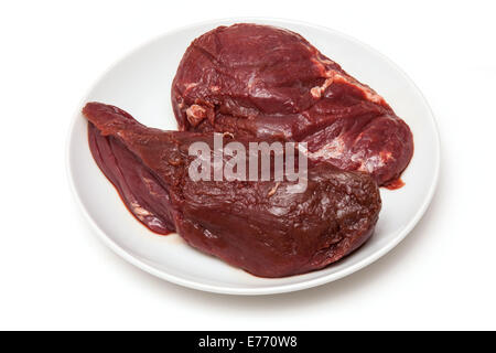 Steaks de viande de kangourou crus isolated on a white background studio. Banque D'Images