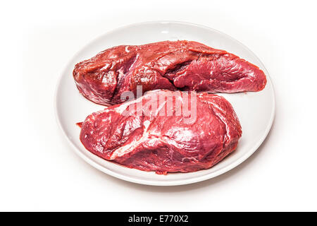 Steaks de viande de kangourou crus isolated on a white background studio. Banque D'Images