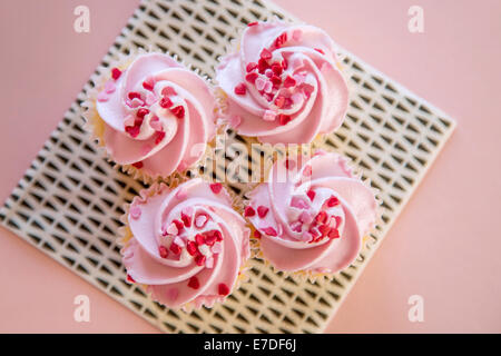Quatre cupcakes rose Banque D'Images