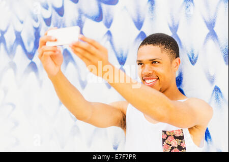 African American man taking cell phone photos Banque D'Images