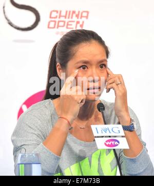 Beijing, Chine. Sep 21, 2014. Célèbre joueur de tennis chinoise Li Na réagit au cours de sa retraite, conférence de presse à Beijing, capitale de la Chine, 21 septembre 2014. La première et la seule gagnante du Grand Chelem Li Na a officiellement annoncé sa retraite le 19 septembre, laissant le tennis chinois aspiration à la prochaine superstar. © Li Wen/Xinhua/Alamy Live News Banque D'Images