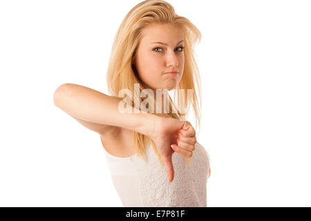 Jeune femme blonde aux yeux bleus, gesticulant et ange avec showing thumb down isolated over white background Banque D'Images