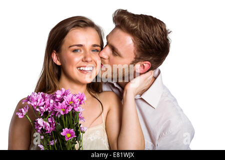 Couple femme comme elle détient des fleurs Banque D'Images