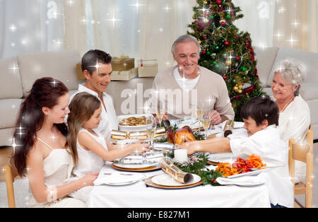 Image composite de frère et soeur tirant un Noël à la maison Banque D'Images