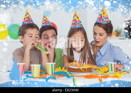 Little girl blowing her candles during her Birthday party Banque D'Images