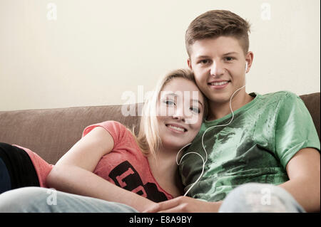 Portrait of woman on couch Banque D'Images