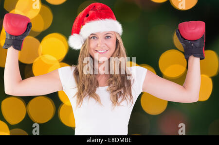 Image composite de blonde de fête avec des gants de boxe Banque D'Images