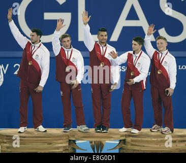 (L à r) Kristian Thomas, Sam Oldham, Louis Smith, Max Whitlock et Nile Wilsone (FRA) avec leurs médailles d'or. Artistique de l'équipe de mens Banque D'Images