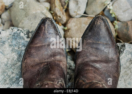 Old weathered bottes de cow-boy Banque D'Images