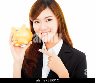 Happy businesswoman holding a piggy bank or .isolé sur fond blanc Banque D'Images