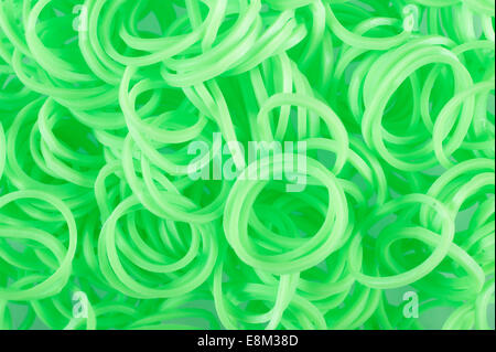 Vert néon lumineux Loom Bandes. Détail. Close up. Banque D'Images