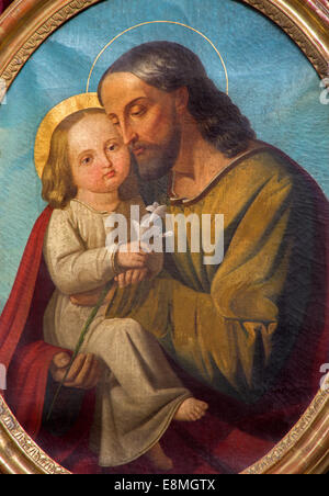 Padoue, Italie - 9 septembre 2014 : Le saint Joseph avec l'enfant dans la peinture de l'autel latéral de la basilique l'église del Carmine Banque D'Images