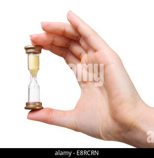 Close up of woman hand holding Hourglass. Isolated on white Banque D'Images