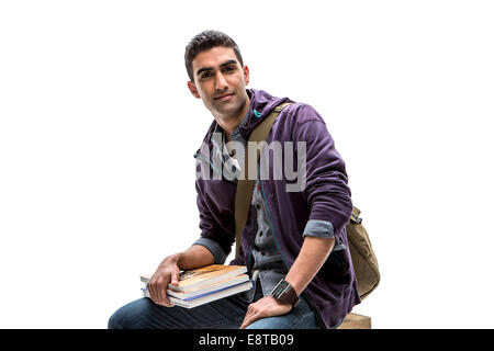 Indian Student holding pile de livres Banque D'Images
